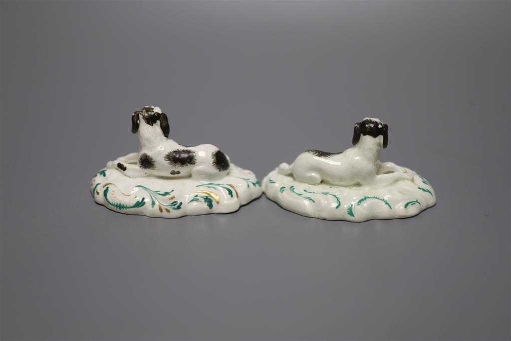 A pair of Staffordshire porcelain recumbent King Charles spaniels, c.1840, height 5cm